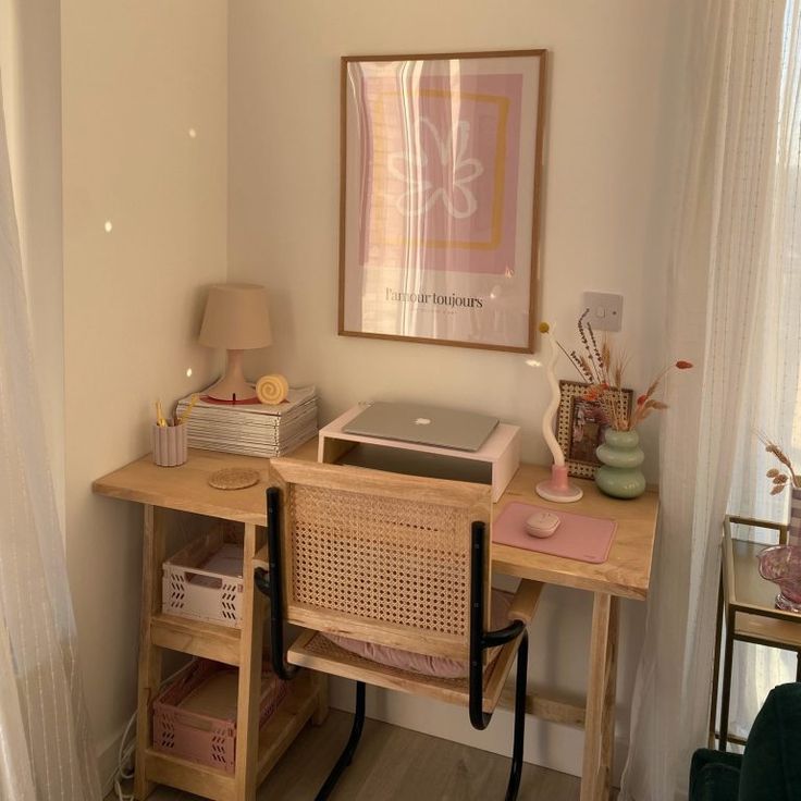 a wooden desk with a laptop on top of it