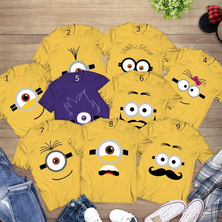 a group of yellow shirts with eyes and mustaches on them, surrounded by other items