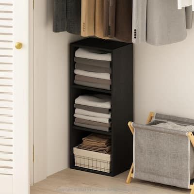 an organized closet with folded clothes and linens on the shelves, next to a laundry hamper