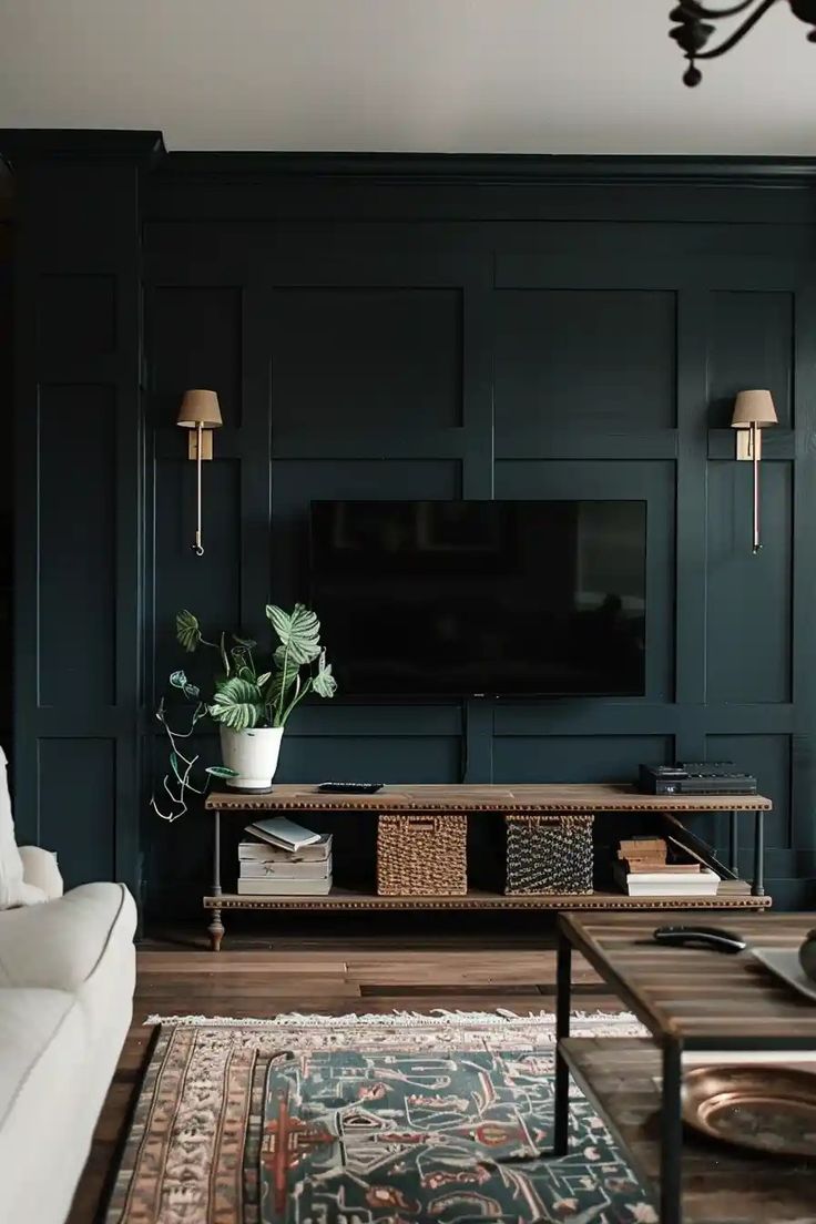 a living room filled with furniture and a flat screen tv mounted on a wall above a wooden coffee table