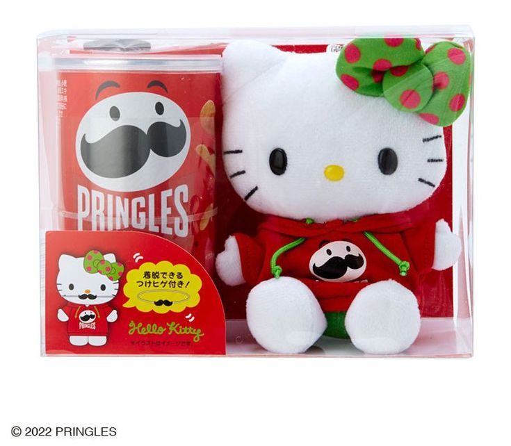 a hello kitty plush toy sitting next to a package of pringle's