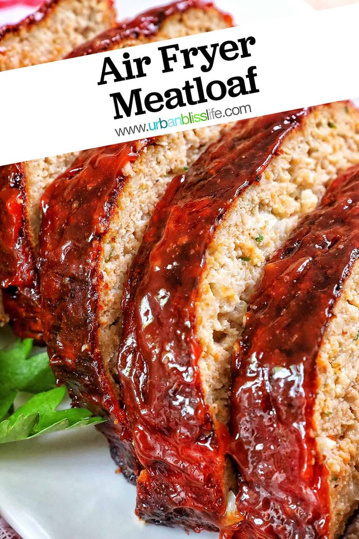 sliced meatloaf on a white plate with lettuce and ketchup