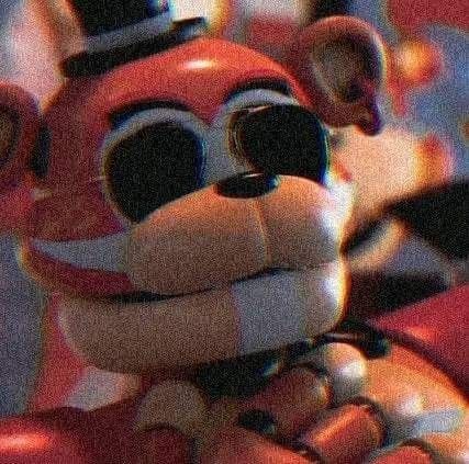 a close up of a stuffed animal wearing a top hat