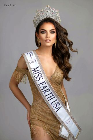 a beautiful woman in a gold dress with a crown on her head and long hair