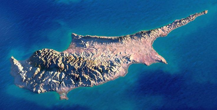 an island is shown in the middle of the ocean, with blue water and green land