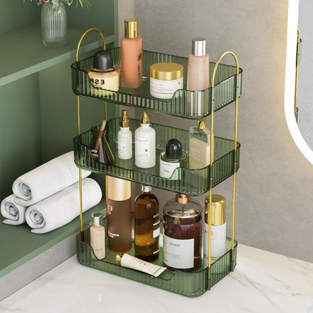 three tiered bathroom shelf with various items on it