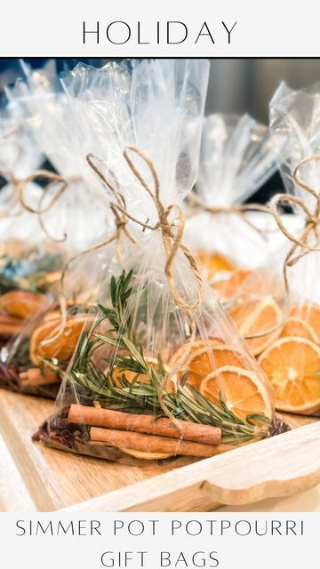 some bags filled with oranges and spices on top of a wooden table next to other items