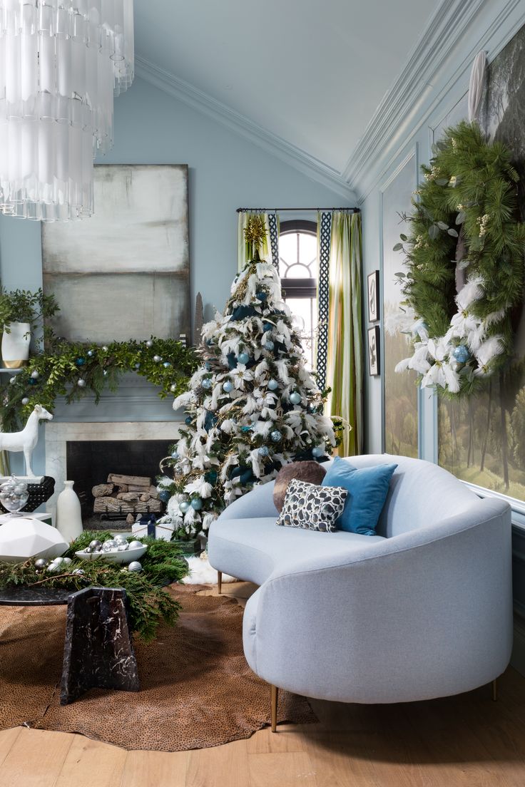 a living room filled with furniture and a christmas tree