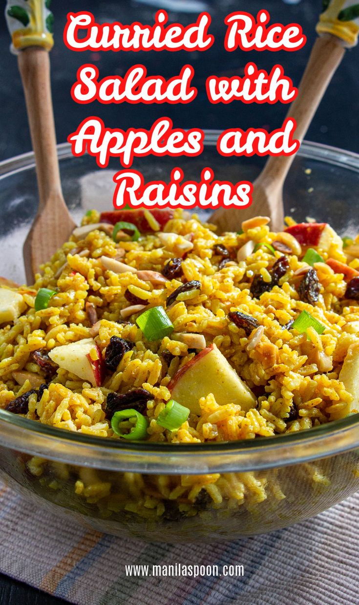 rice salad with apples and raisins in a glass bowl