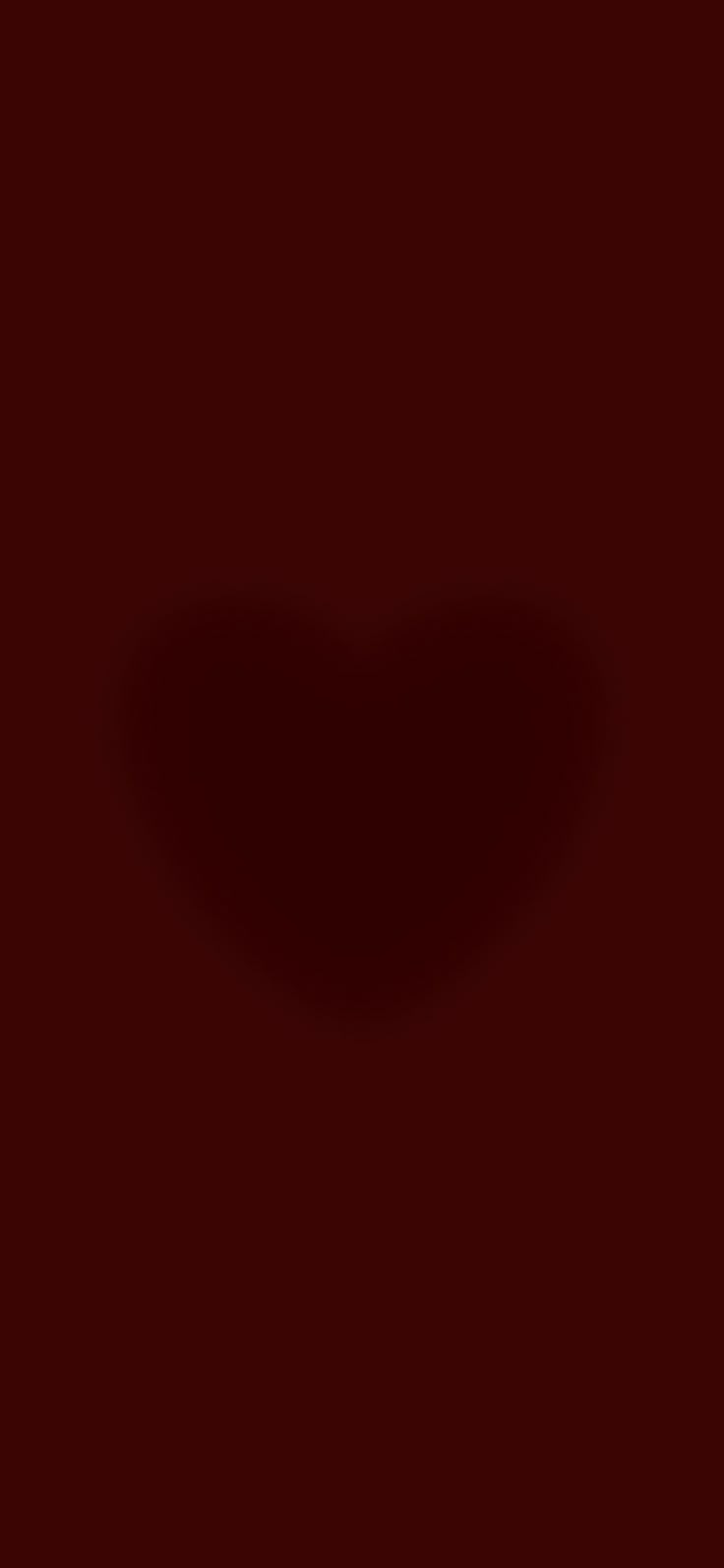 a heart shaped shadow on a dark red background