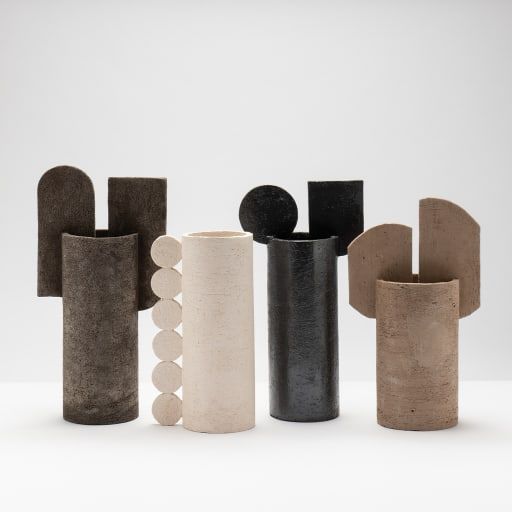 four different types of vases sitting side by side