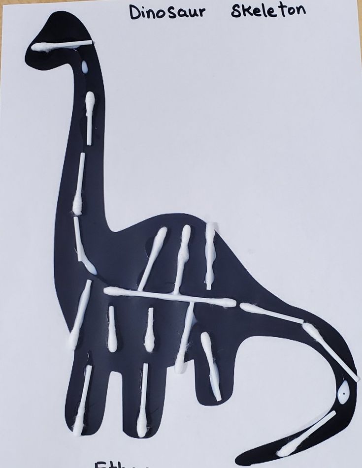 a drawing of a dinosaur with white paint on it