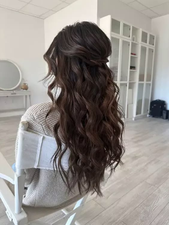 Discover Trendy Half Up Half Down Bridal Hairstyles for Every Hair Length Mermaid Curls Wedding Hair, Long Beach Waves Wedding Hairstyles, Beach Waves Hairstyles Half Up, Hair Inspo For Bridesmaid, Updo Beach Hairstyles, Beach Waves Bride Hair, Wavy Hairstyles For Long Hair Half Up, Beach Waves Hair Wedding Bridesmaid, Bridesmaid Hairstyles With Clip In Extensions