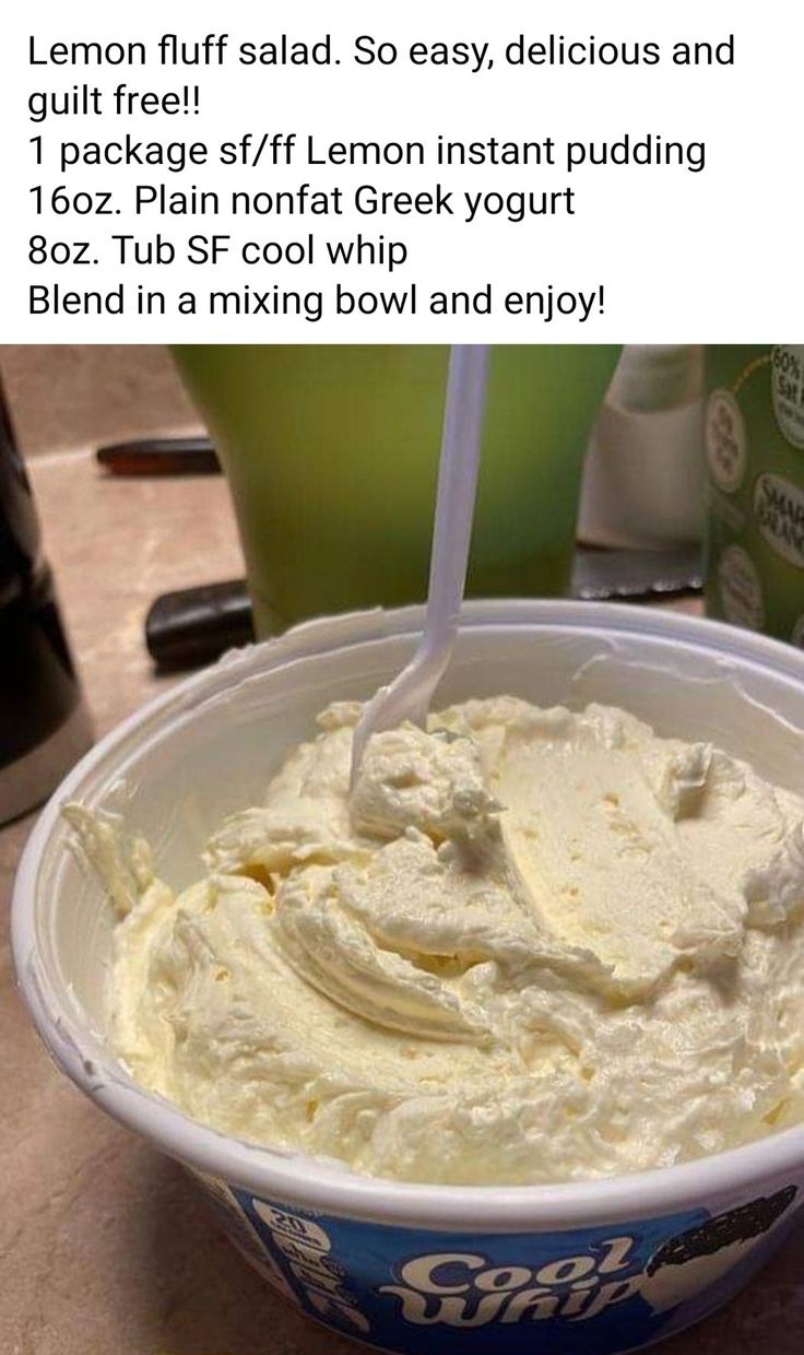 a bowl filled with cream sitting on top of a table