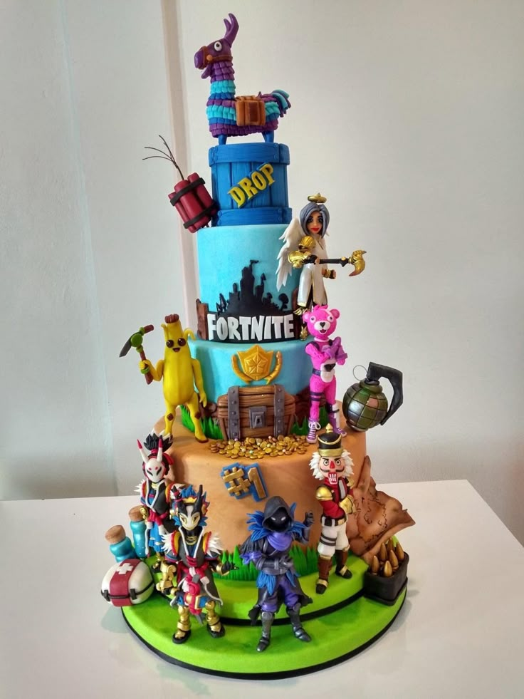 a birthday cake decorated with cartoon characters on it's sides and the words fortnite