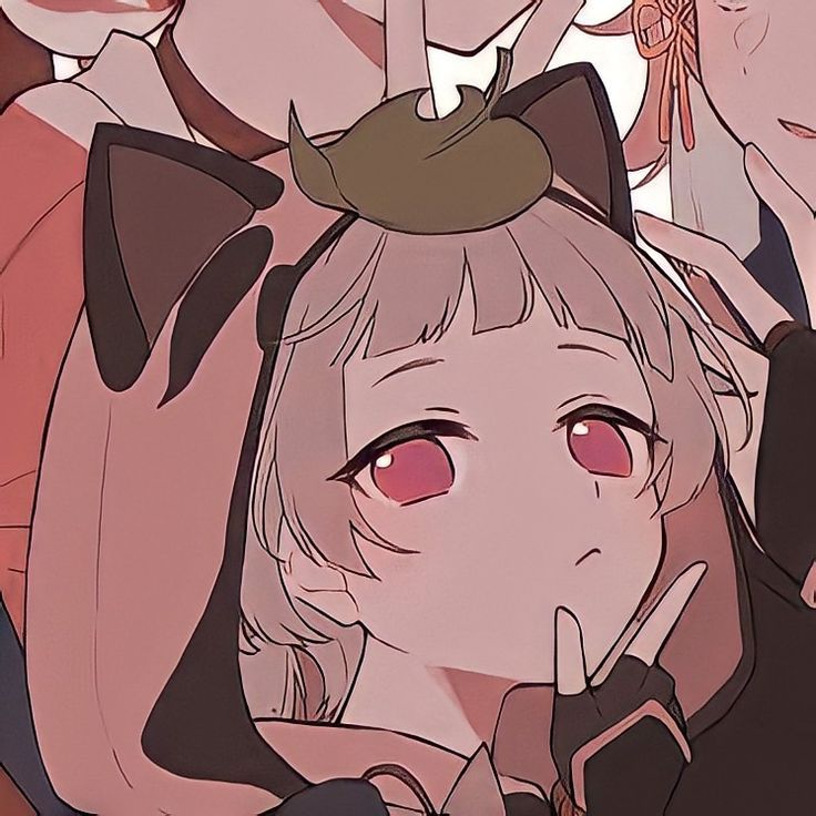 an anime character with cats on her head and two other characters behind her looking at the camera