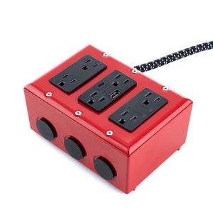 a red box with three black outlets attached to the side and a black cord connected to it