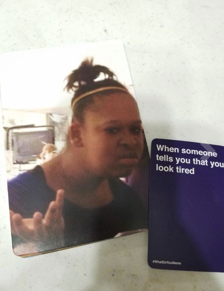 a photo of a woman with her hand up in front of the camera, and an ad for cell phones