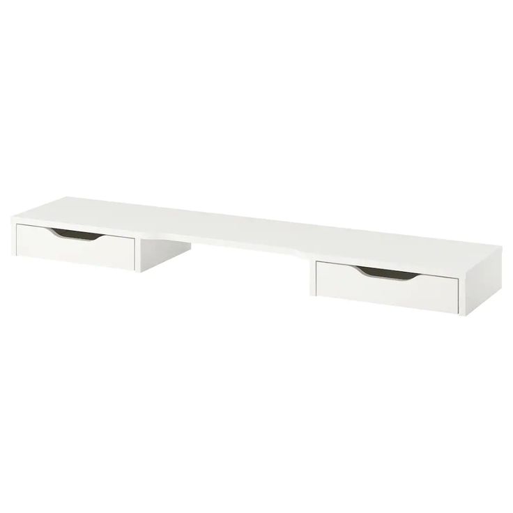 a white shelf with two drawers on it