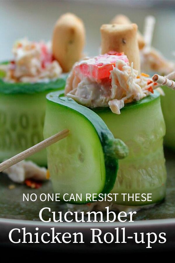 cucumber chicken roll - ups on a plate with chopsticks in them