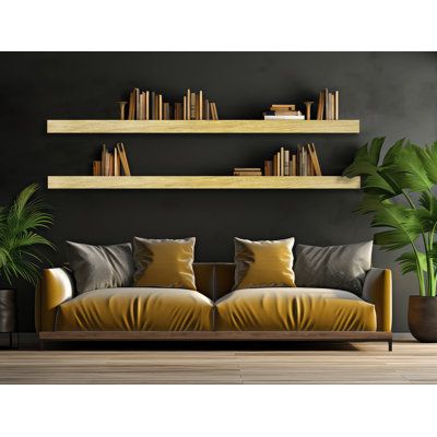 a living room filled with lots of furniture and bookshelves next to a potted plant