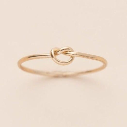 This delicate knot ring is incredibly versatile! Worn solo, stacked or as the perfect midi. Gift this "love knot to your friends, family or someone who needs a lift. It's a beautiful token of the ties that weave our lives together. Details:Location: Finger (order larger or smaller sizes depending on which finger you choose to wear it)Thickness: 1mmSizes: 5,6,7,8Style: Minimalist/DaintyMade with: 14K Gold Filled Ring Inspo, Love Knot Ring, Knot Ring, Love Knot, Tie Knots, Cute Jewelry, Rose Gold Ring, Gold Filled, Gold Rings