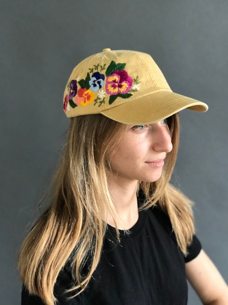 Hand embroidered women hat with floral design / baseball hat for women Color: mustard baseball cap. Design: hand-embroidered flowers. Cap size (head circumference): 55 - 67 cm. The quality of the embroidery and baseball cap is superior, I guarantee! ;) I really enjoyed making this, and I hope my customer will enjoy showing it off. 🌿PLEASE NOTE THIS HAT IS READY TO SHIP🌿 CHECK OUR OTHER ACCESSORIES 🌸 More Baseball hats: https://www.etsy.com/shop/KazkovaEmbroidery?ref=seller-platform-mcnav§ion_ Yellow Baseball Cap With Curved Brim, Yellow Trucker Hat Baseball Cap For Spring, Vintage Baseball Cap For Spring, Yellow Trucker Hat With Curved Brim For Spring, Vintage Baseball Visor Cap For Spring, Vintage Visor Baseball Cap For Spring, Yellow Baseball Cap For Spring, Yellow Flat Brim Baseball Cap, Yellow Baseball Cap With Embroidered Logo