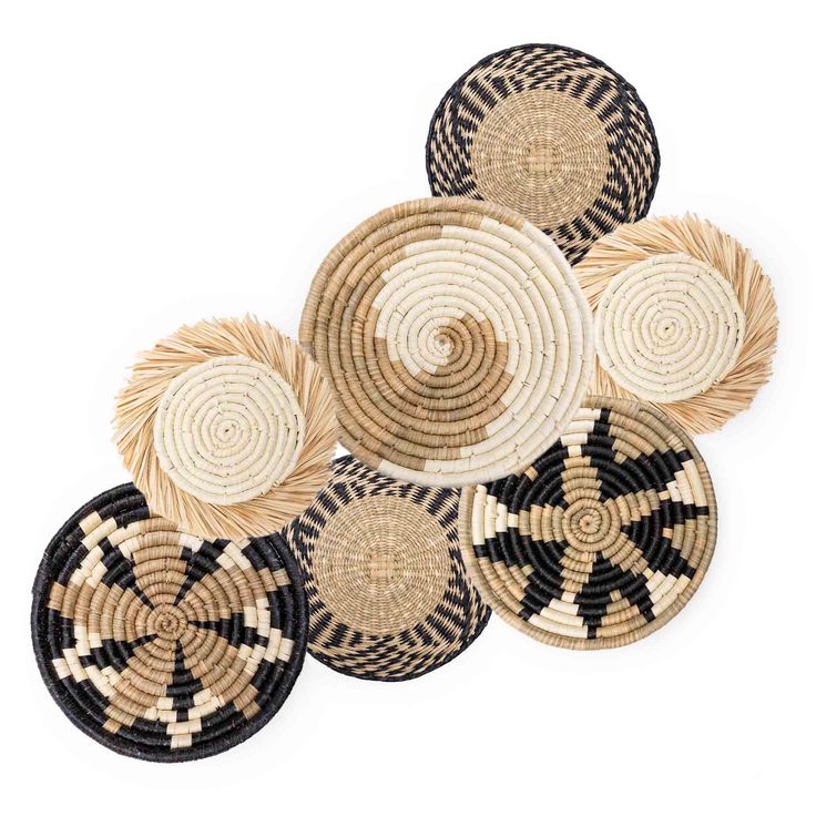 black and white woven baskets stacked on top of each other with circles in the middle