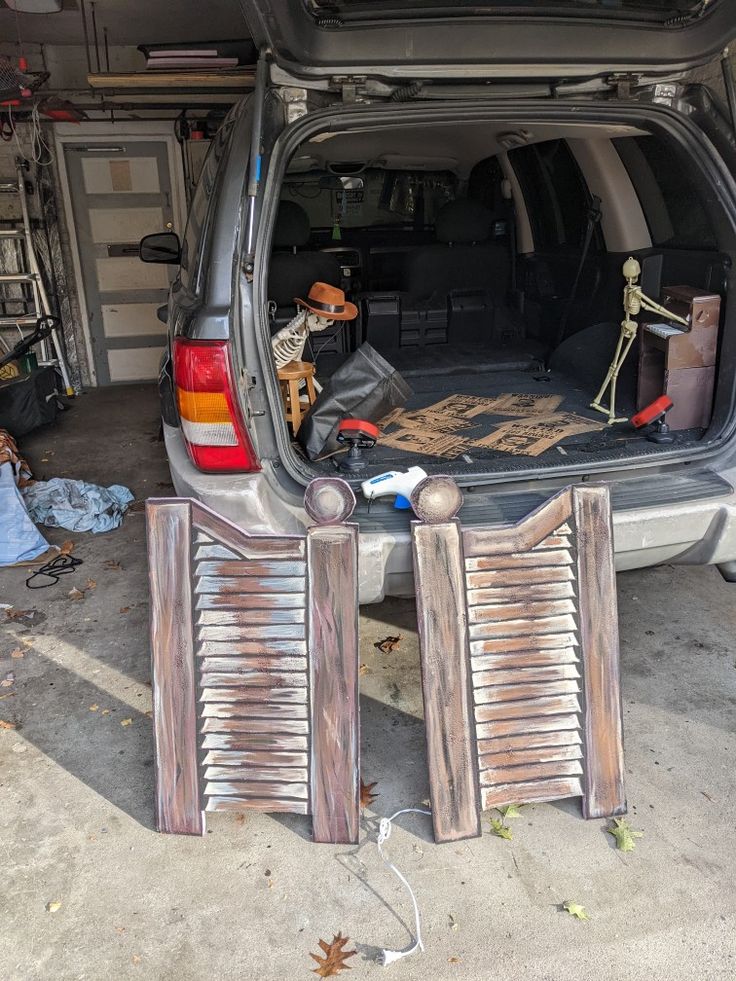 the back end of a car with skeleton decorations in it