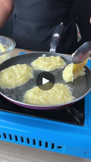 someone is cooking food in a pan on the stove