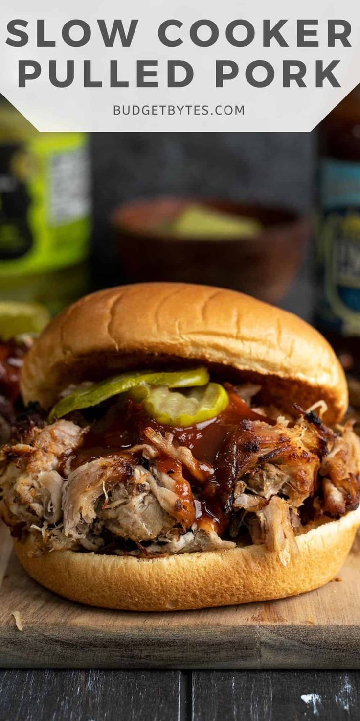 slow cooker pulled pork sandwich on a cutting board