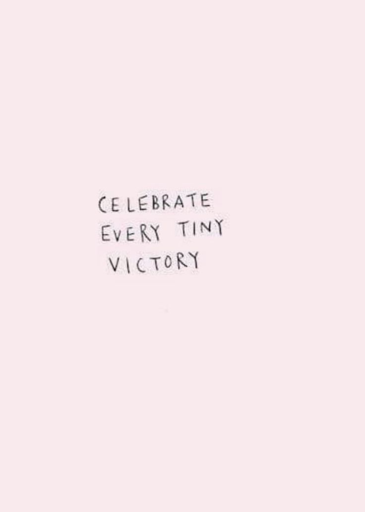 the words celebrate every tiny victory are written in black ink on a pink paper background