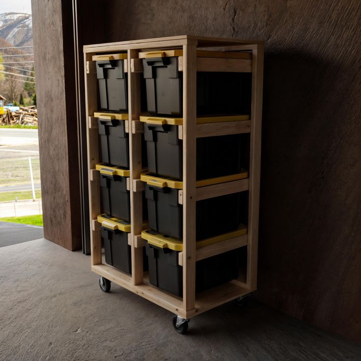 a wooden cart filled with lots of black containers