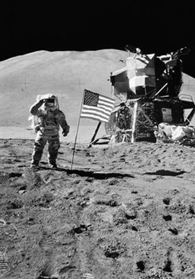 an astronaut standing on the moon next to two american flags