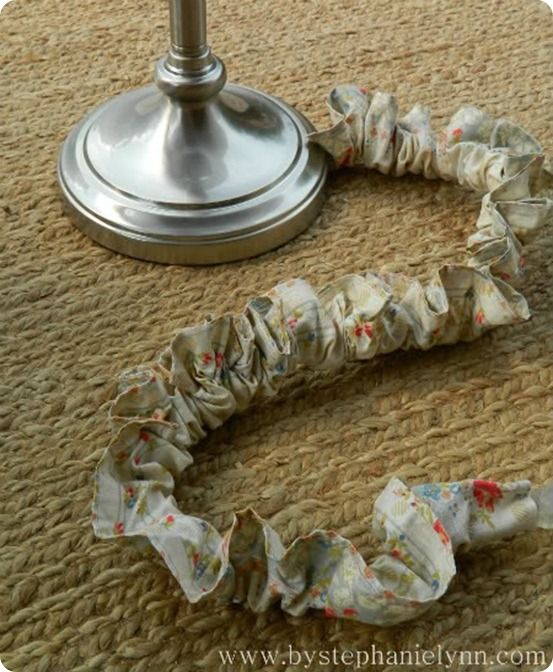 a pair of scrunffles laying on the floor next to a table lamp