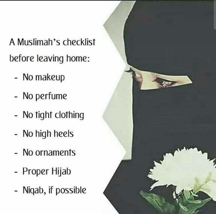 a woman wearing a black hijab and holding a white flower in her hand