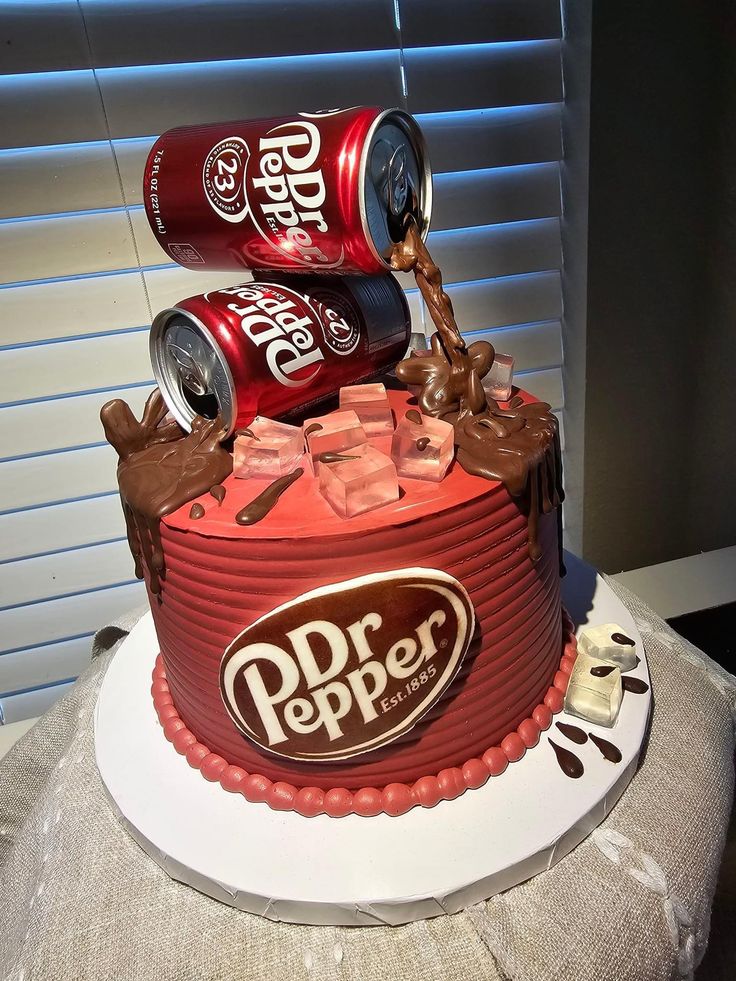 a birthday cake made to look like a can of dr pepper with chocolate and ice cream on top