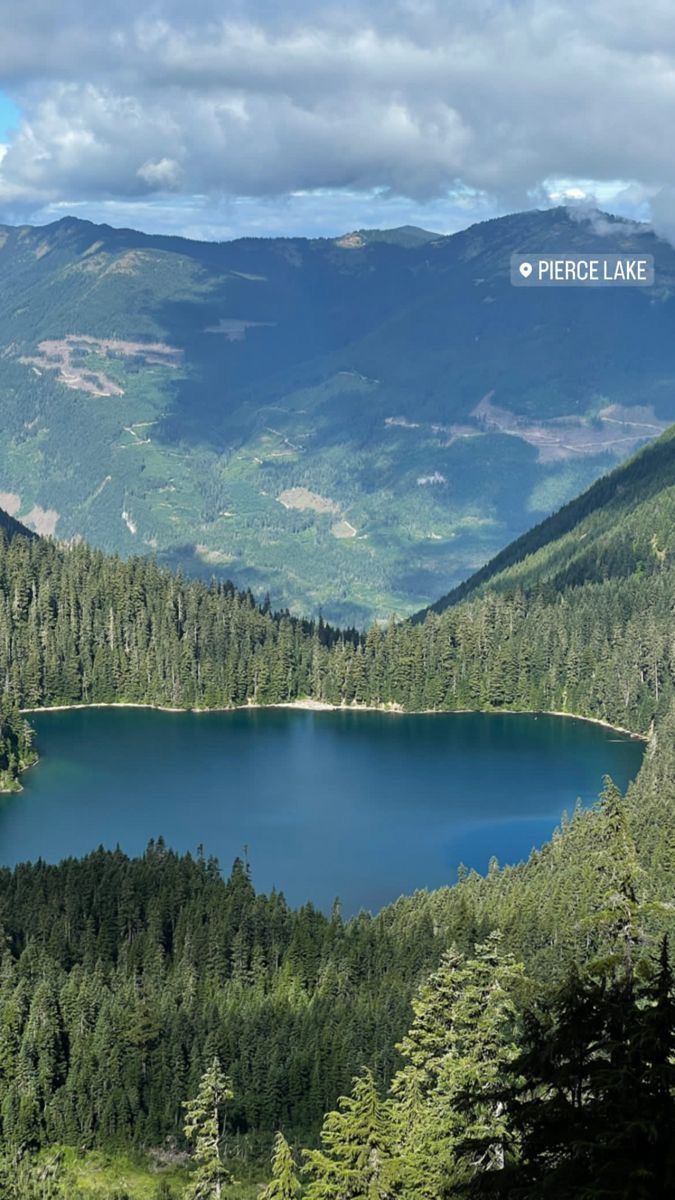 a large lake surrounded by mountains and trees