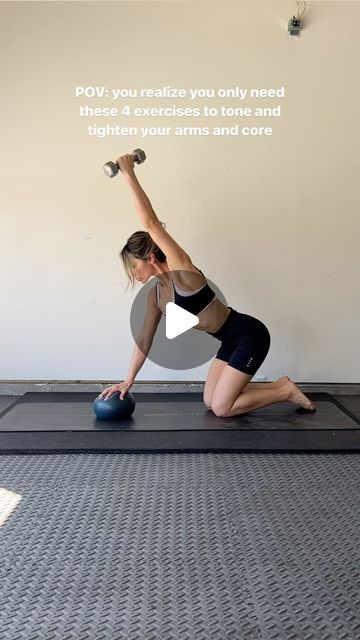 a woman is doing an exercise on a mat with dumbbells and a kettle