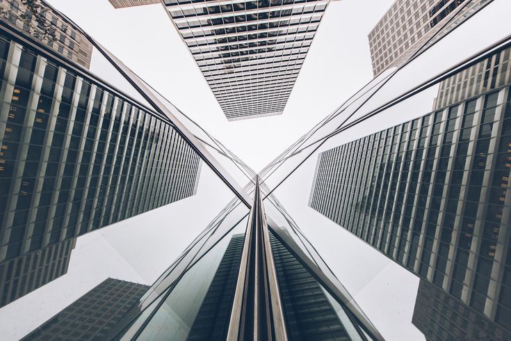 looking up at tall buildings from the ground