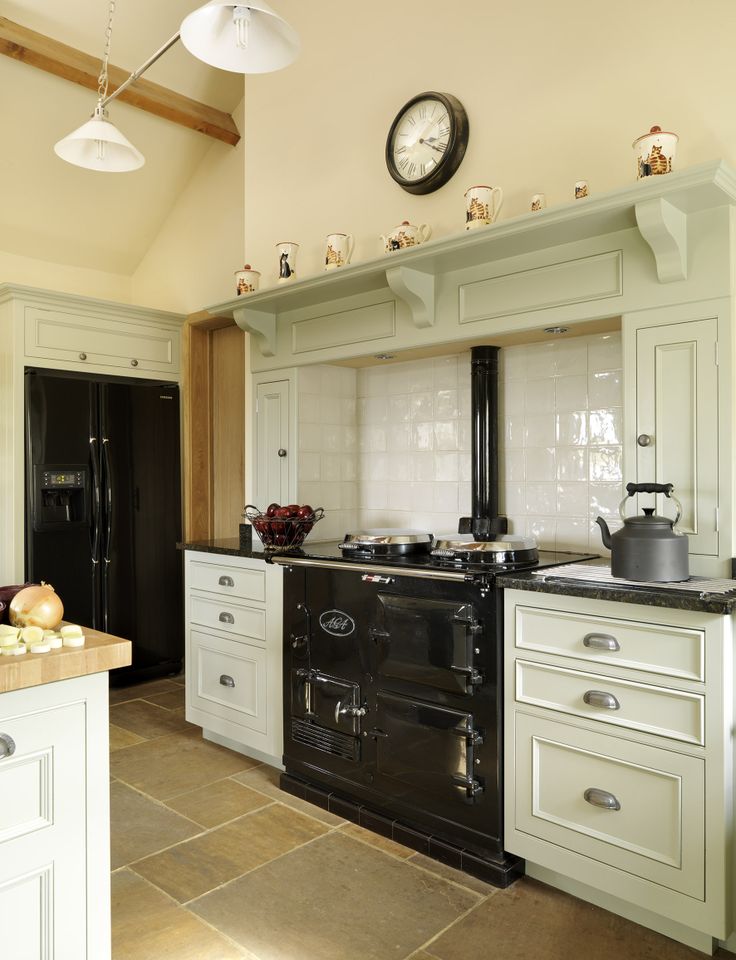 a kitchen with an oven, stove and sink