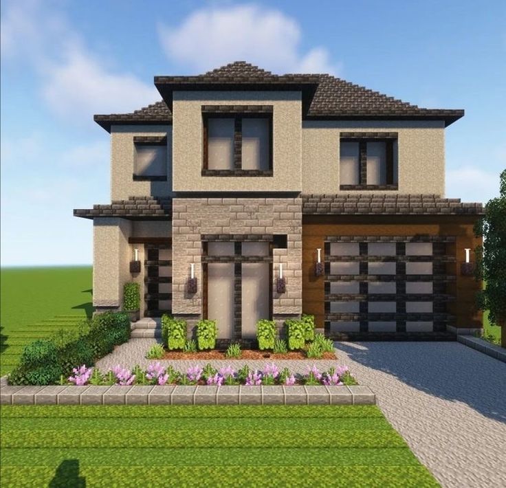 a two story house with lots of windows and landscaping