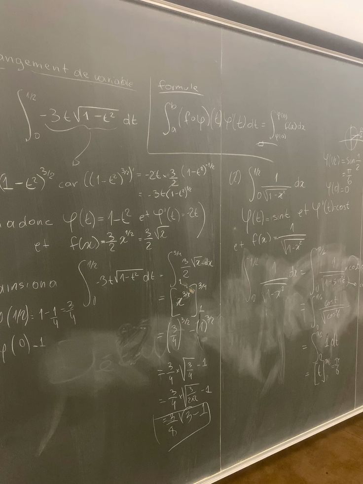 a blackboard with many calculations written on it