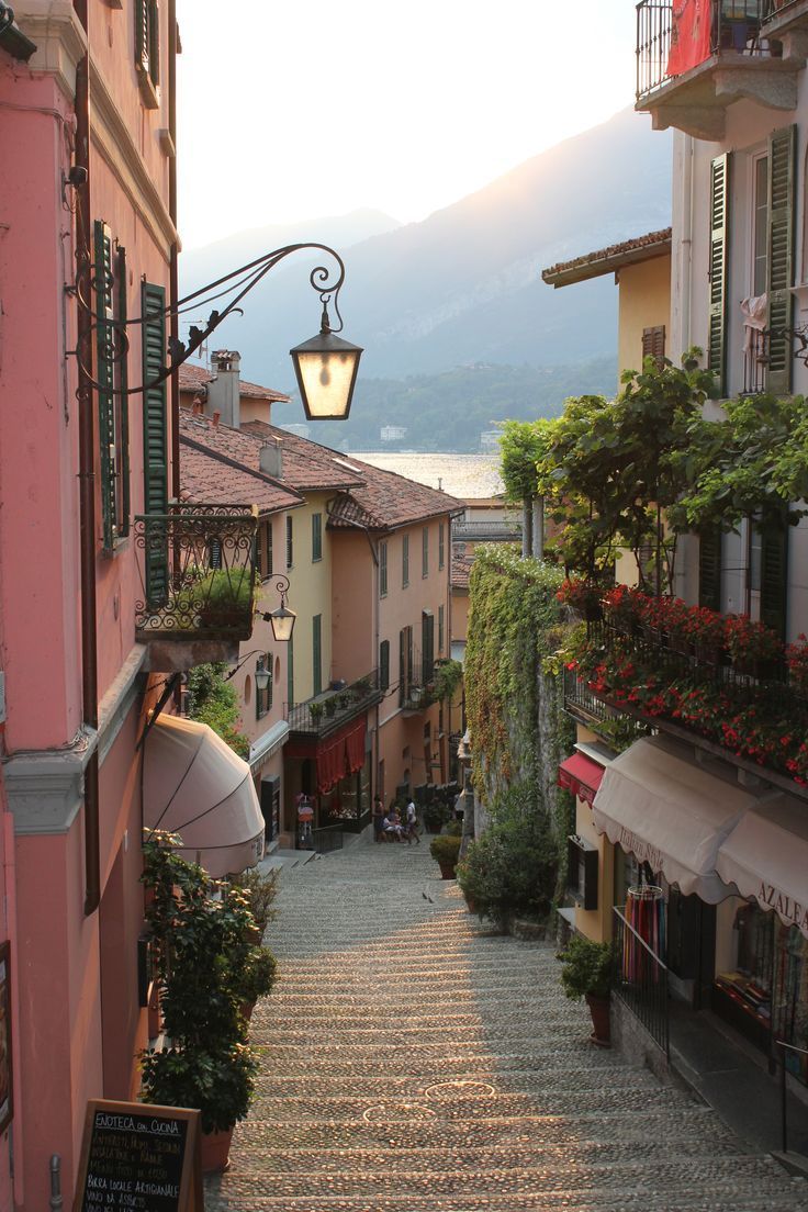 an alley way with steps leading up to buildings