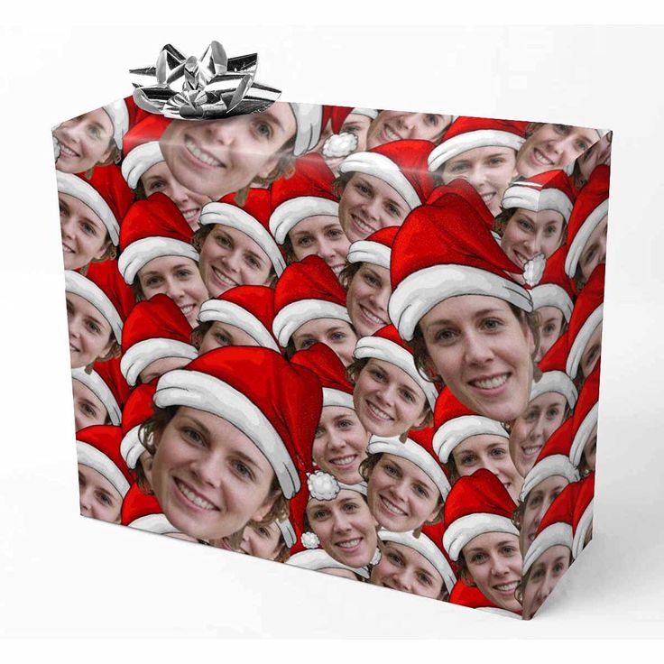 a gift bag with an image of people wearing santa hats