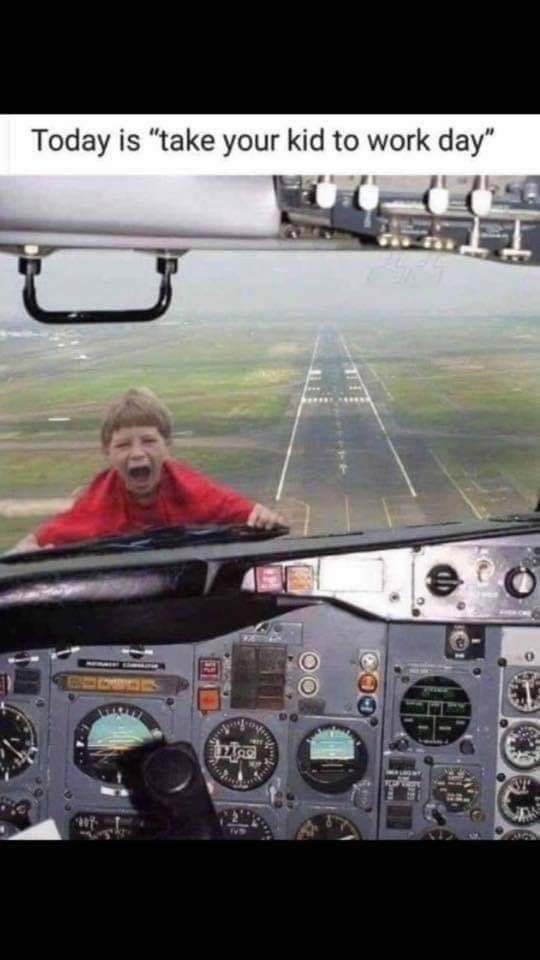 a man sitting in the cockpit of an airplane with his mouth open and looking at the camera