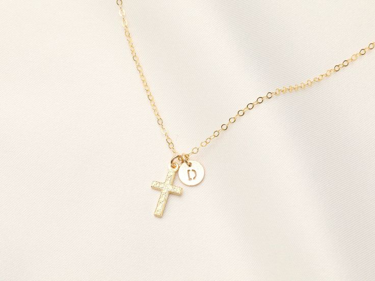 14k Gold Filled Tiny Cross with Initial Necklace / Miraculous / Catholic Necklace / Baptism Necklace / Communion , Letter Necklace  INSTRUCTION: 1. Choose the length of the chain. 2. Select how many charms (1 disc or + 2 discs + 3 discs + 4 discs or more) 3. In the Personalization Box - Please indicate the Letter of choice, all letter will be in capital letters only. 4. Indicate the order you want the letters will be Example: Letter D, R, J, Cross , OR Cross D, R, J (please indicate order of the Cross Necklace With Initial, Personalized Gold Necklaces For Baptism, Personalized Yellow Gold Necklaces For First Communion, Personalized Gold Necklace For Baptism, Personalized Yellow Gold Necklace For First Communion, Personalized Gold Cross Necklace For Wedding, Personalized Gold Cross Necklace For First Communion, Cross Necklace Simple, Catholic Necklace