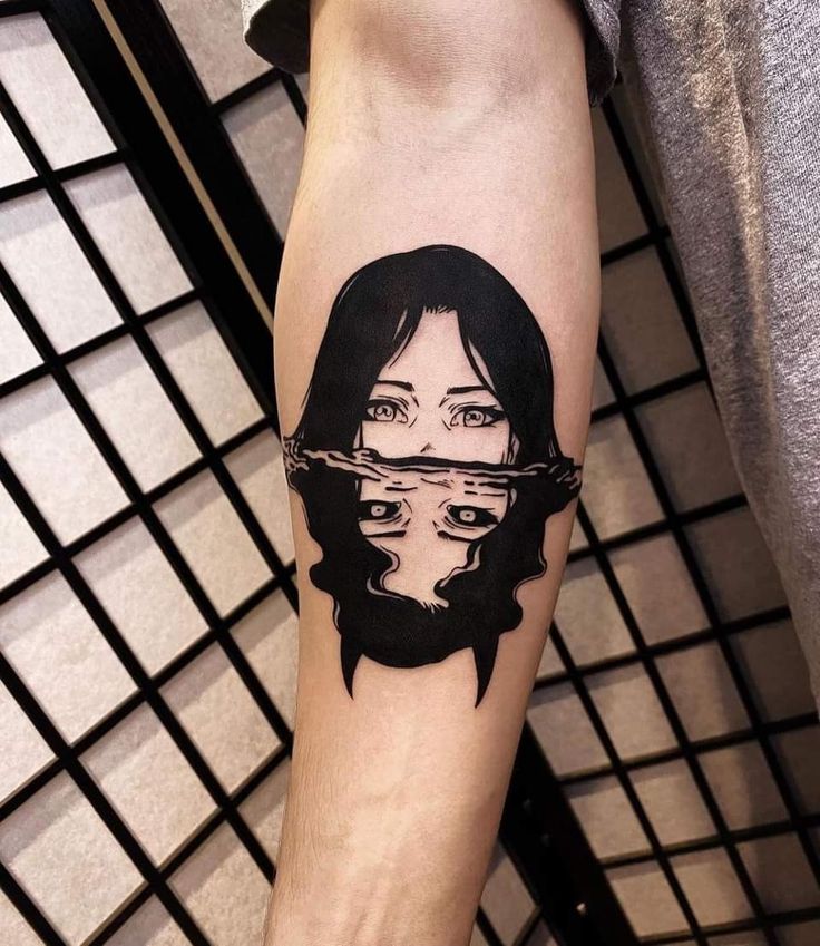 a person with a tattoo on their arm that has a woman's face in the water