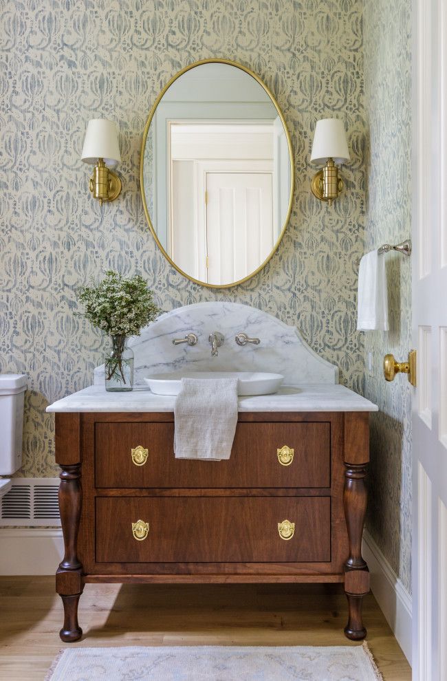 a bathroom sink with a mirror above it