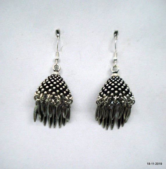 Traditional Design Sterling silver earring pair from rajasthan india. great handmade design, good for your jewellery collection.Note - Pictures is part of Description. Please check pictures carefully for more detail.height with bells - 5.6 cm(2.2")width max.. - 2 cm(0.8")weight - 23 gramsmaterial - good sterling silver. Silver Fusion Earrings, Silver Fusion Style Metal Earrings, Nickel Free Silver Fusion Earrings, Nickel-free Silver Fusion Earrings, Handmade Silver Metal Jhumkas, Handmade Dangle Earrings For Diwali, Traditional Pierced Danglers For Festivals, Traditional Silver Nickel-free Danglers, Nickel-free Traditional Silver Danglers